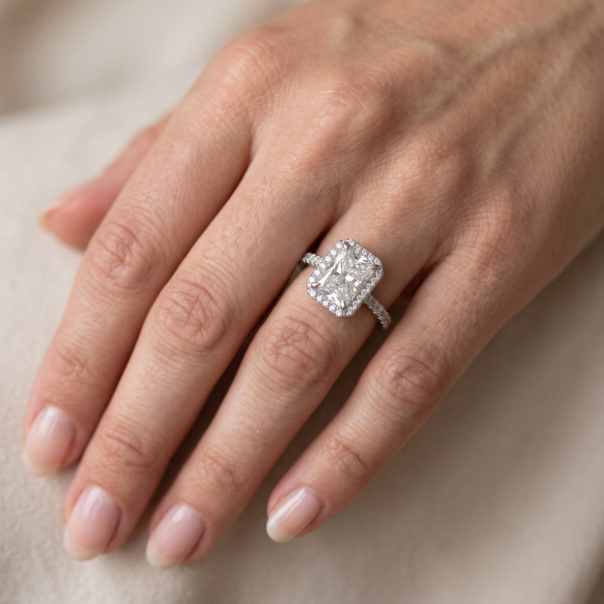 Amara Halo Claw Prong Radiant Diamond Engagement Ring in Platinum - lifestyle.jpg