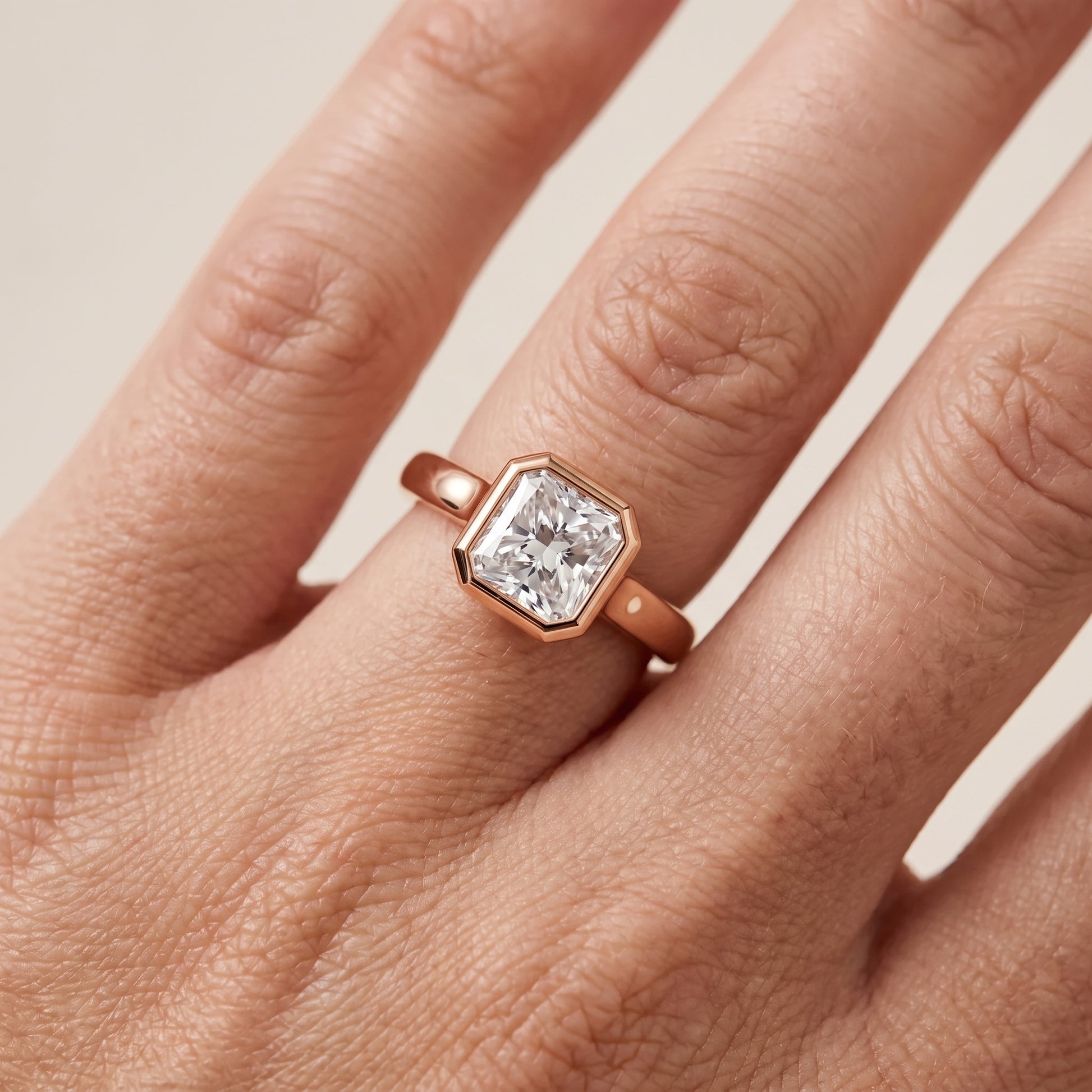 Jolie Bezel Solitaire Radiant Diamond Engagement Ring in Rose Gold - lifestyle.jpg
