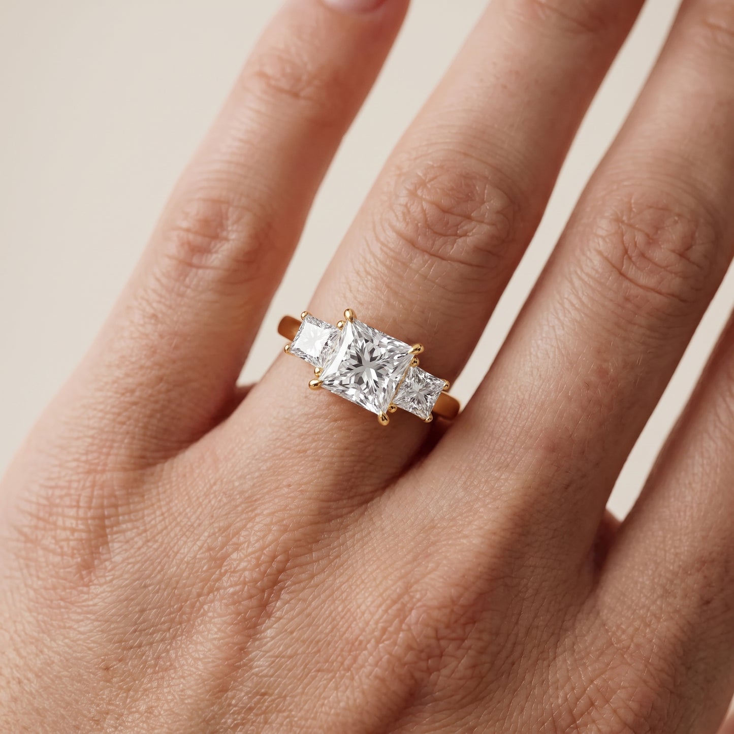 Sienna Three-Stone Princess Diamond Ring in Yellow Gold - lifestyle.jpg