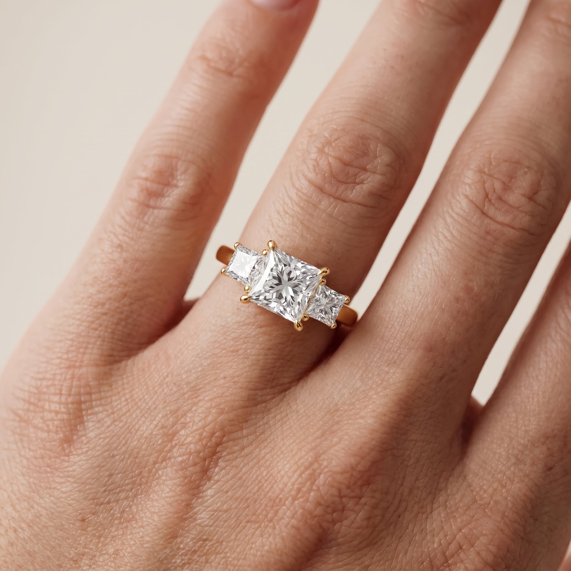 Sienna Three-Stone Princess Diamond Ring in Yellow Gold - lifestyle.jpg