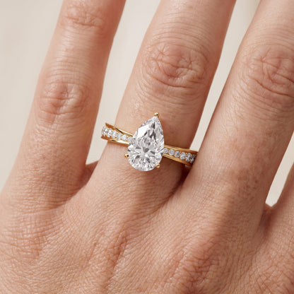 Rhea Sidestone Pavé Pear Diamond Engagement Ring in Yellow Gold - lifestyle.jpg