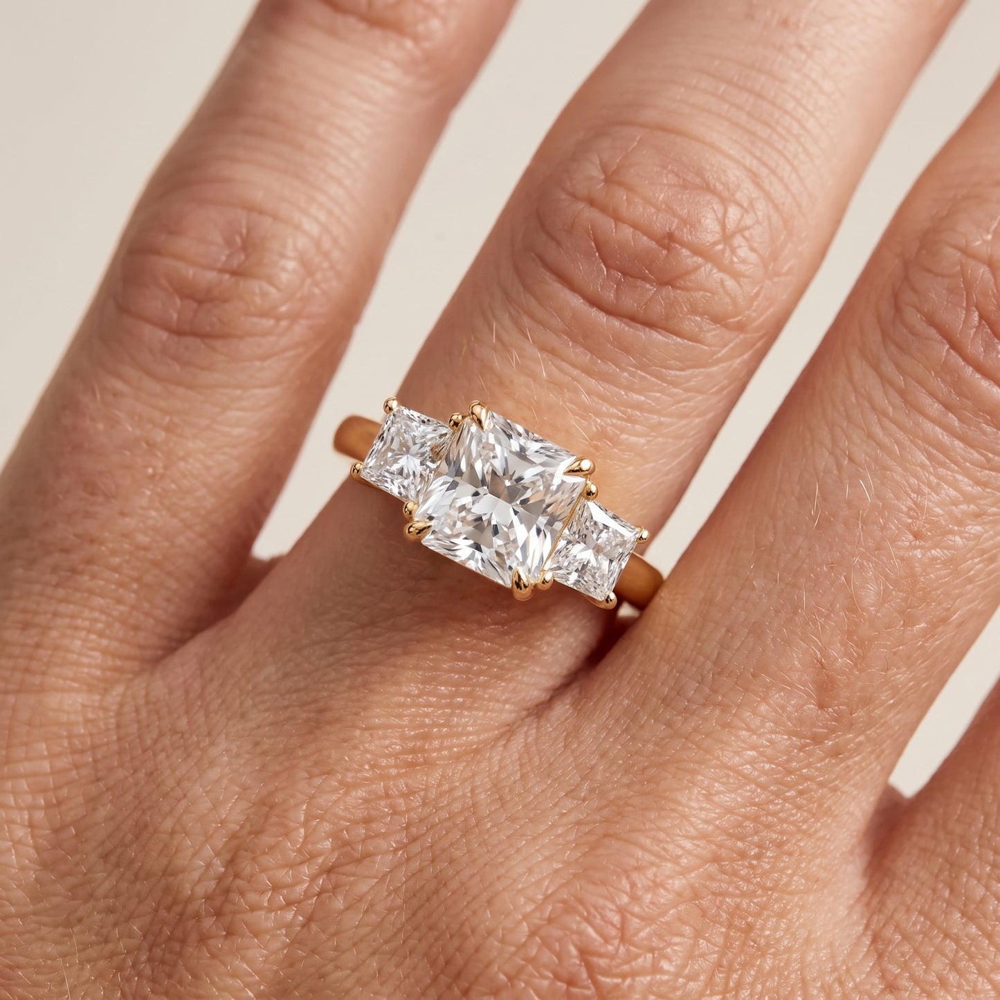 Sienna Three-Stone Radiant Diamond Ring in Yellow Gold - lifestyle.jpg