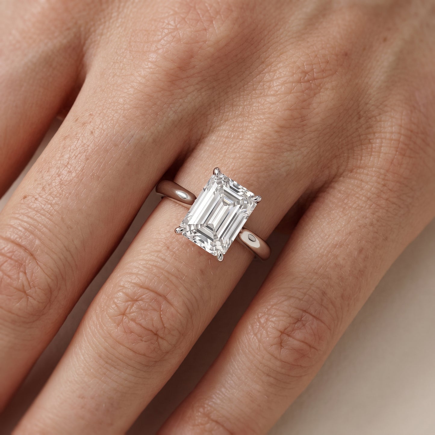 Evie Solitaire Six-Prong Emerald Diamond Engagement Ring in White Gold - lifestyle.jpg