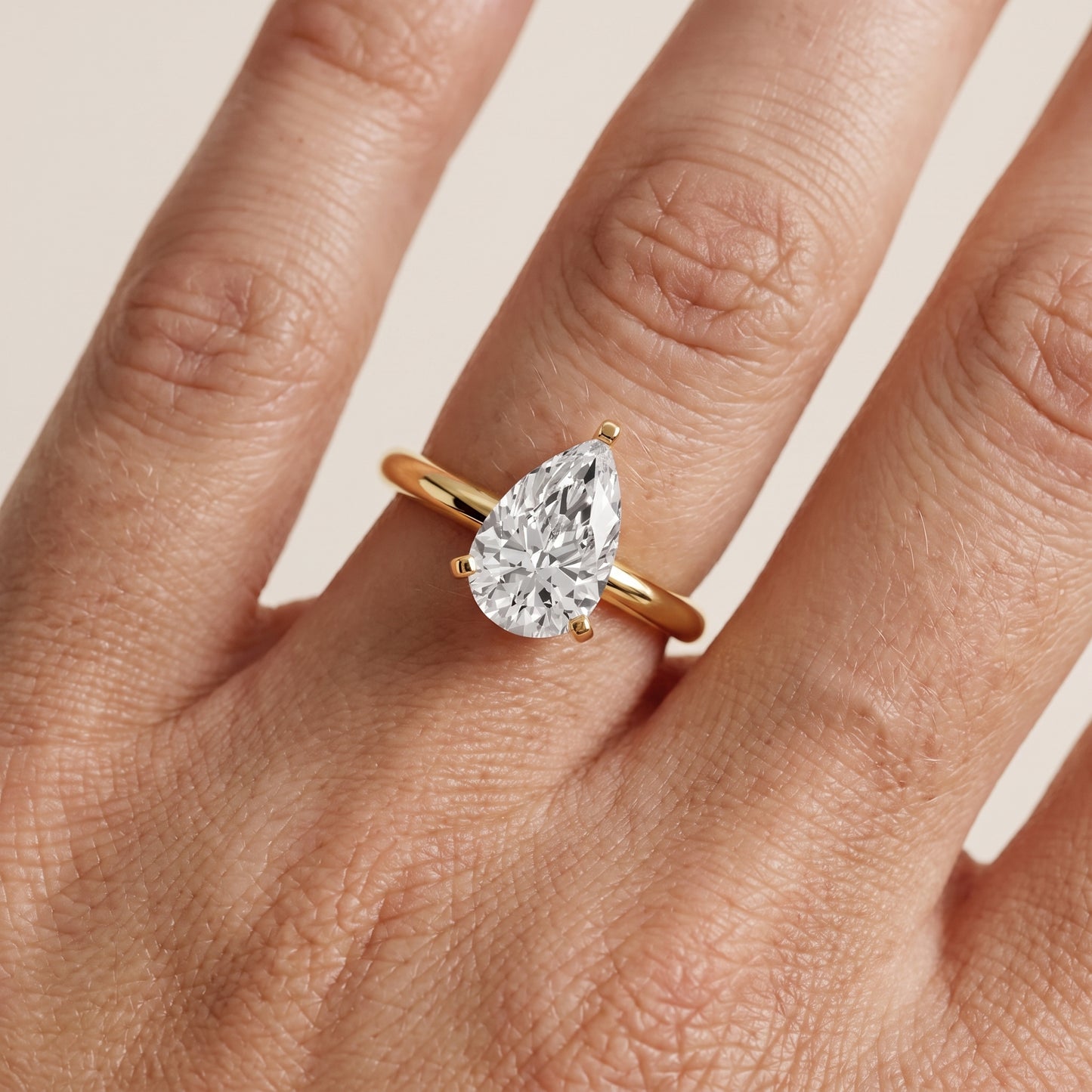 Wren Solitaire Pear Diamond Ring in Yellow Gold - lifestyle.jpg