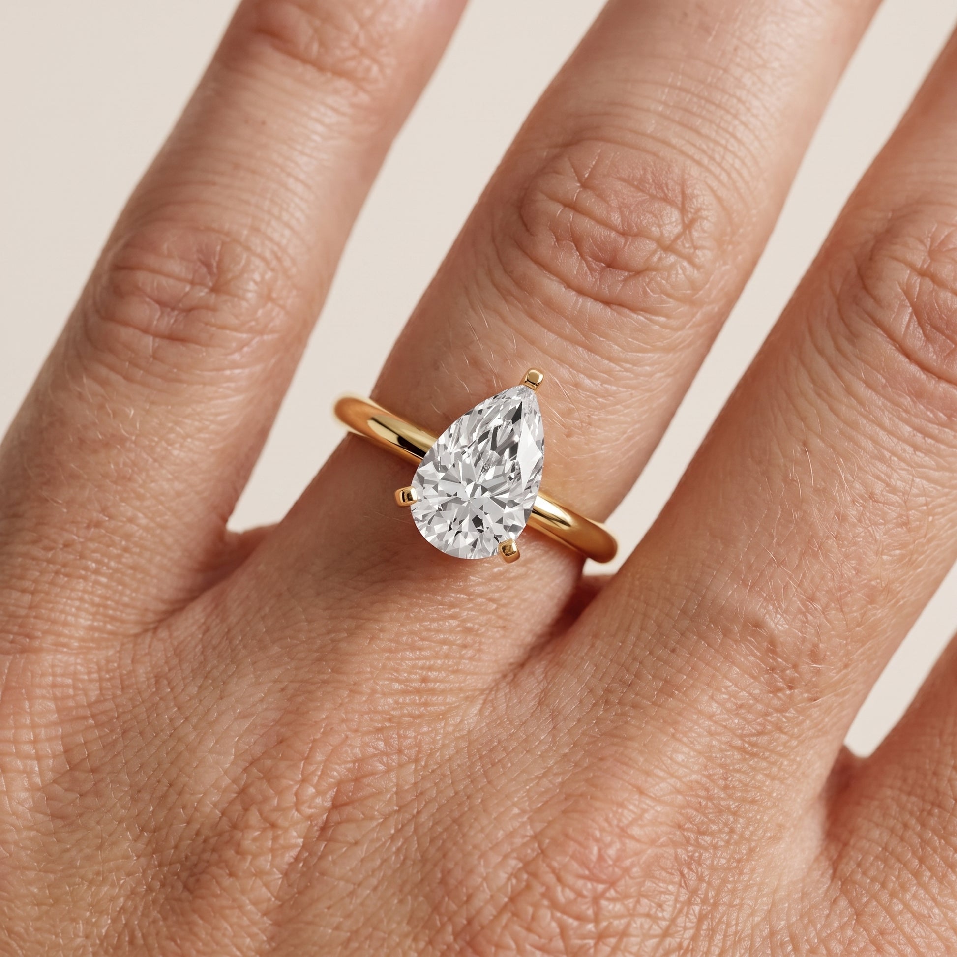 Wren Solitaire Pear Diamond Ring in Yellow Gold - lifestyle.jpg
