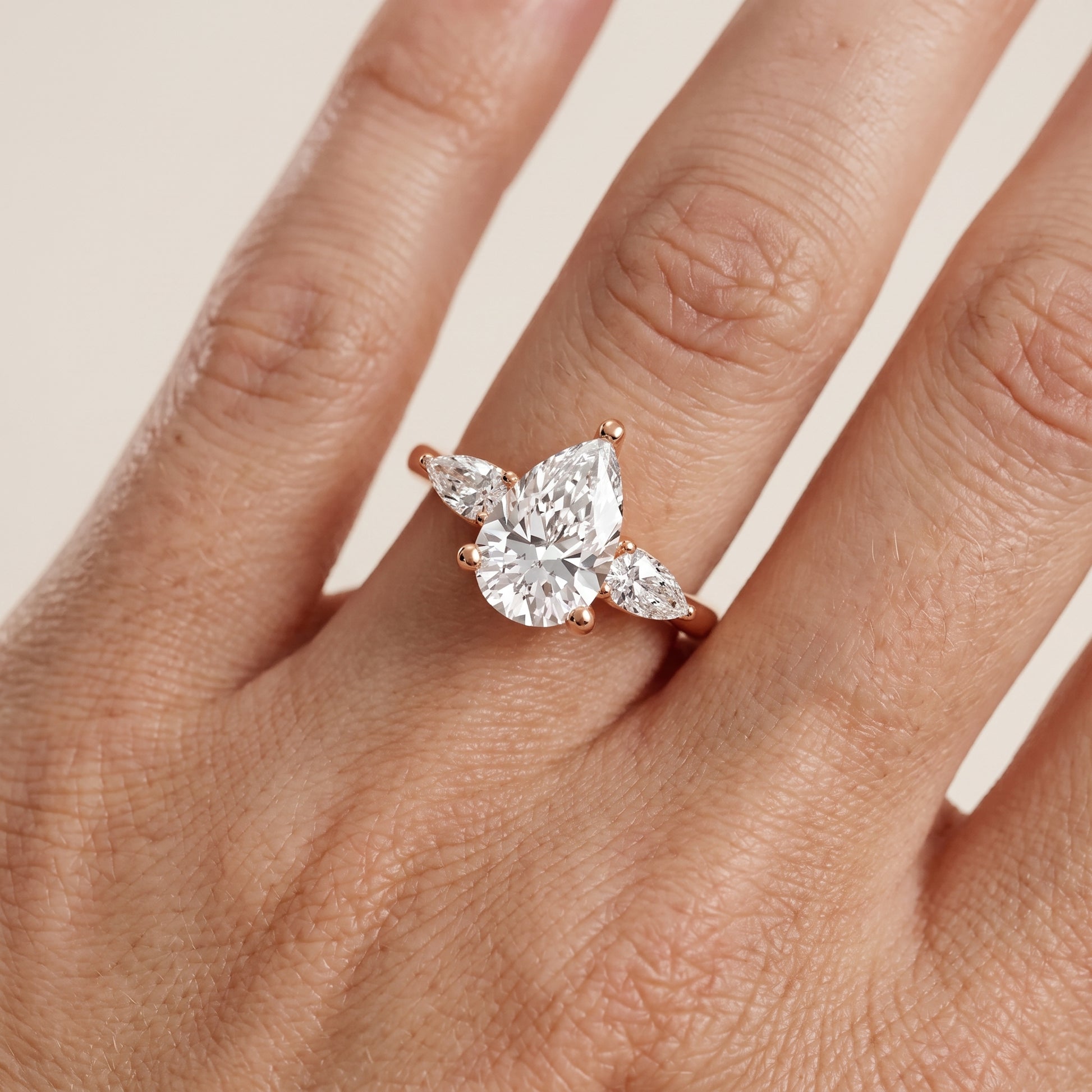 Faye Three-Stone Trellis Pear Diamond Ring in Rose Gold - lifestyle.jpg
