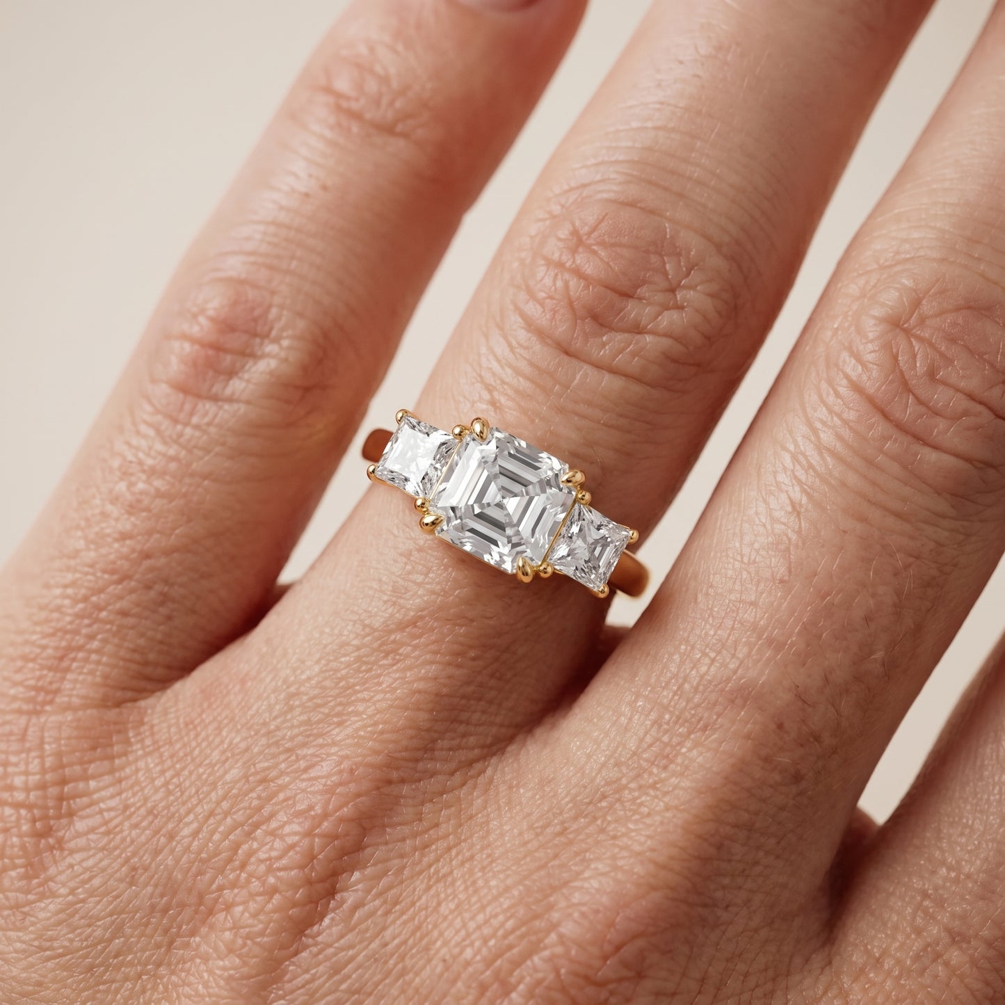 Sienna Three-Stone Asscher Diamond Ring in Yellow Gold - lifestyle.jpg