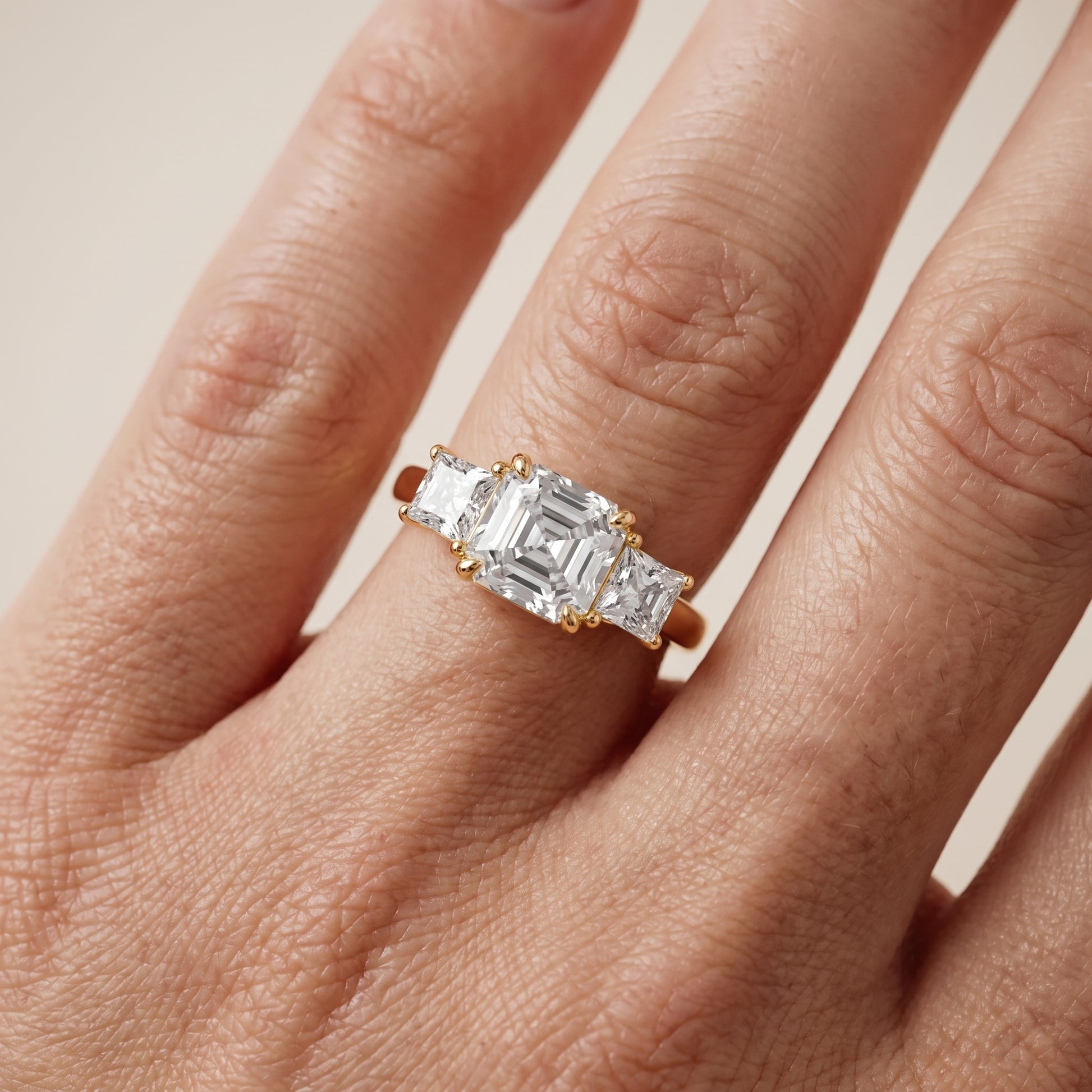 Sienna Three-Stone Asscher Diamond Ring in Yellow Gold - lifestyle.jpg