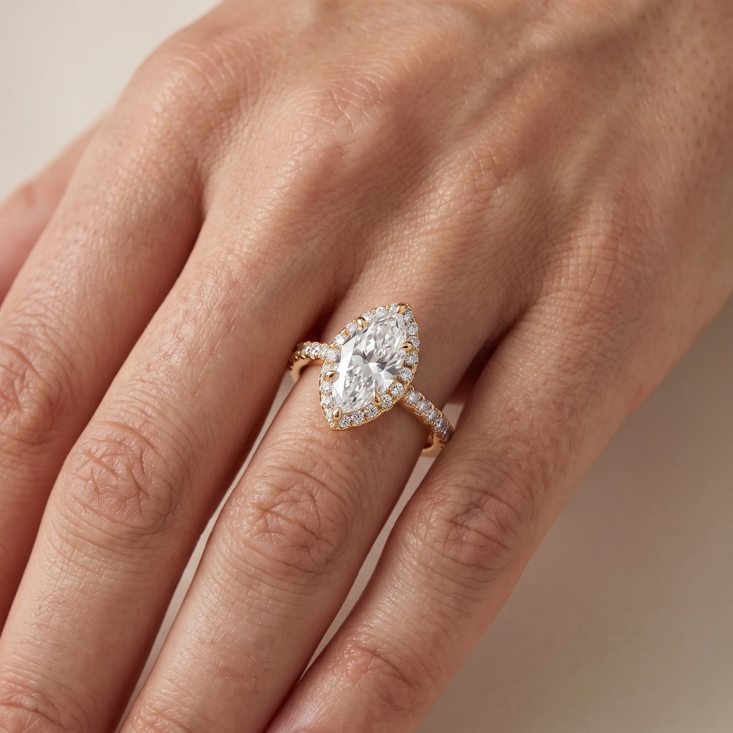 Amara Halo Claw Prong Marquise Diamond Ring in Yellow Gold - lifestyle.jpg