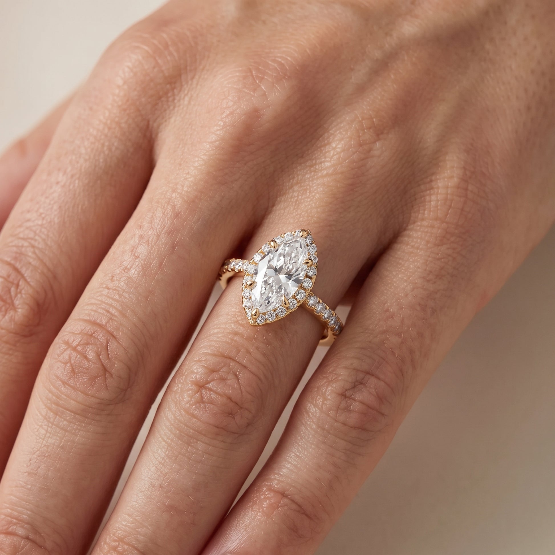 Amara Halo Claw Prong Marquise Diamond Ring in Yellow Gold - lifestyle.jpg