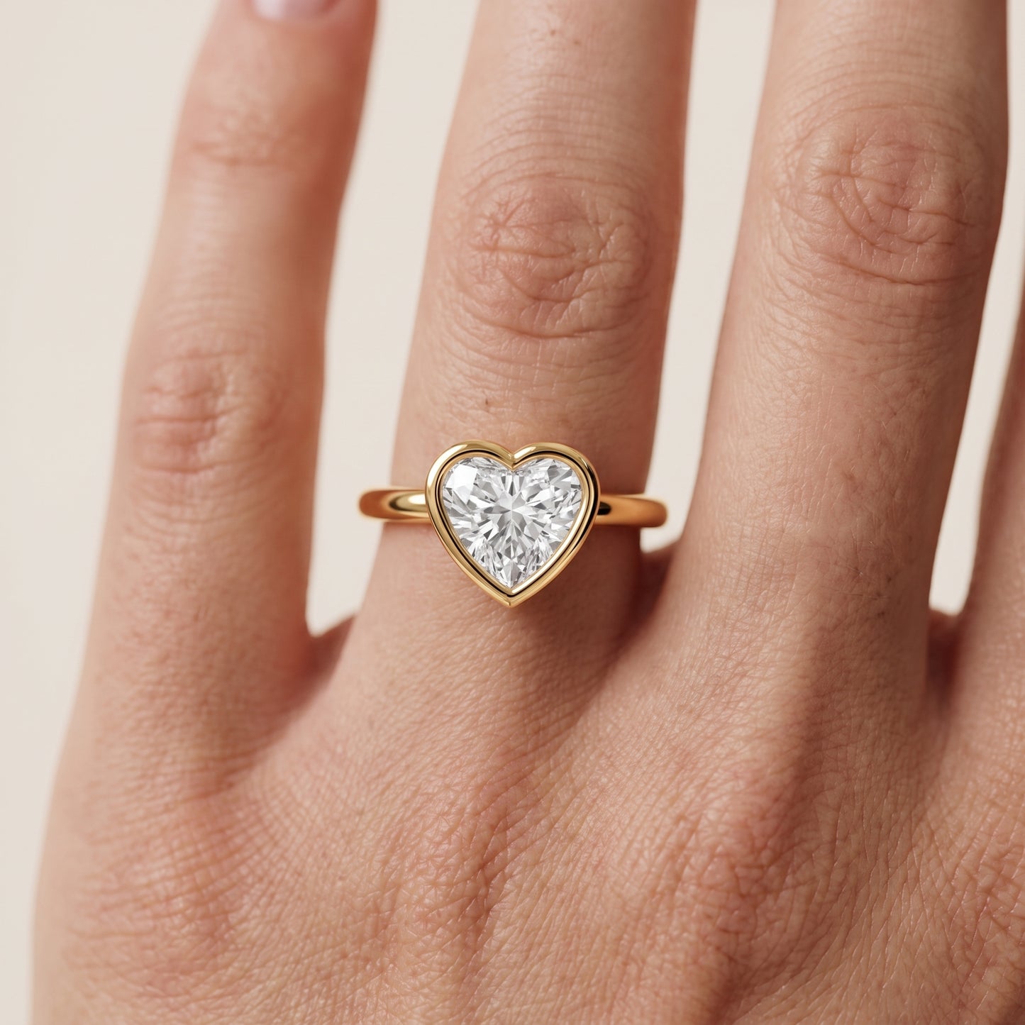 Maeve Bezel Solitaire Heart Diamond Ring in Yellow Gold - lifestyle.jpg