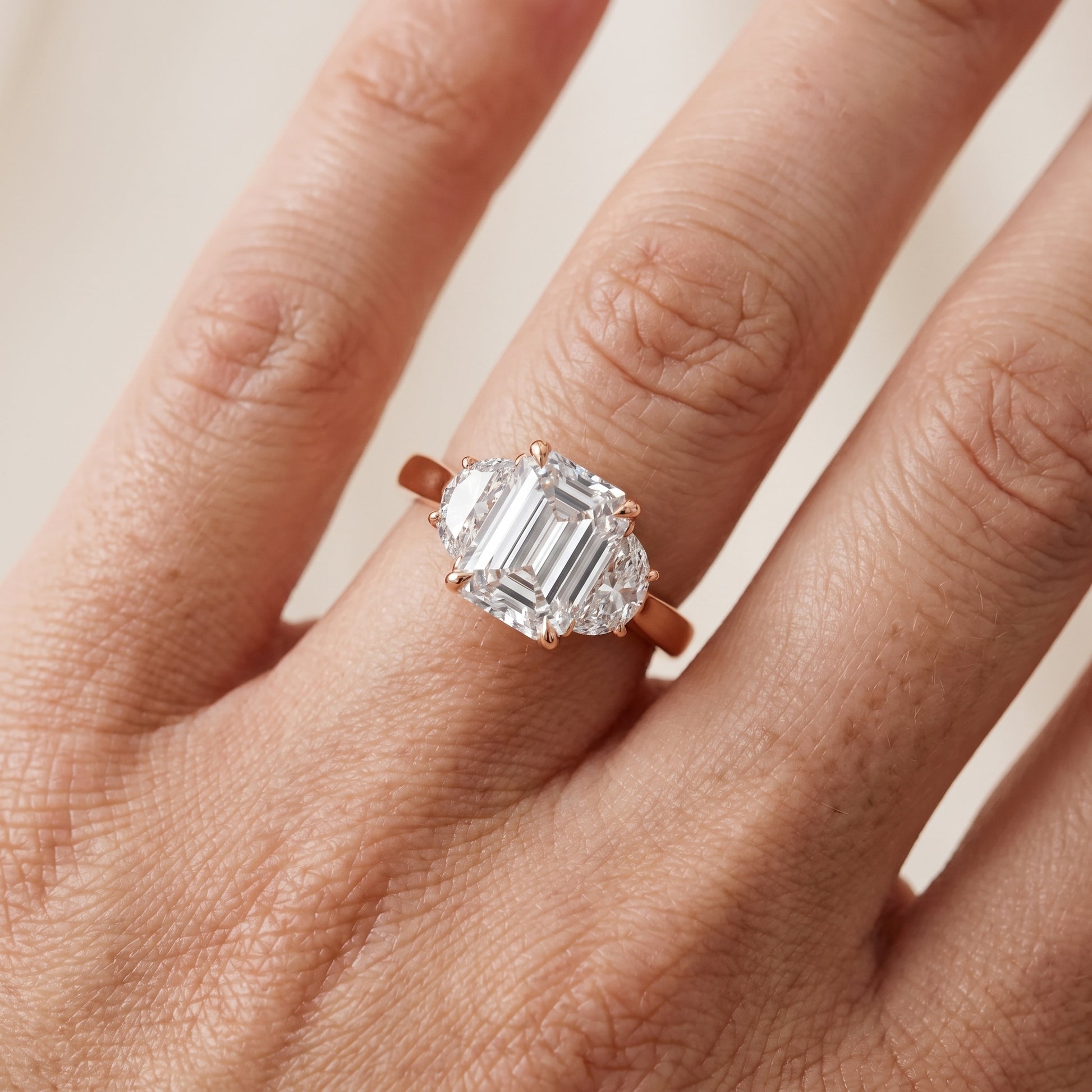 Romy Three-Stone Emerald Diamond Engagement Ring in Rose Gold - lifestyle.jpg