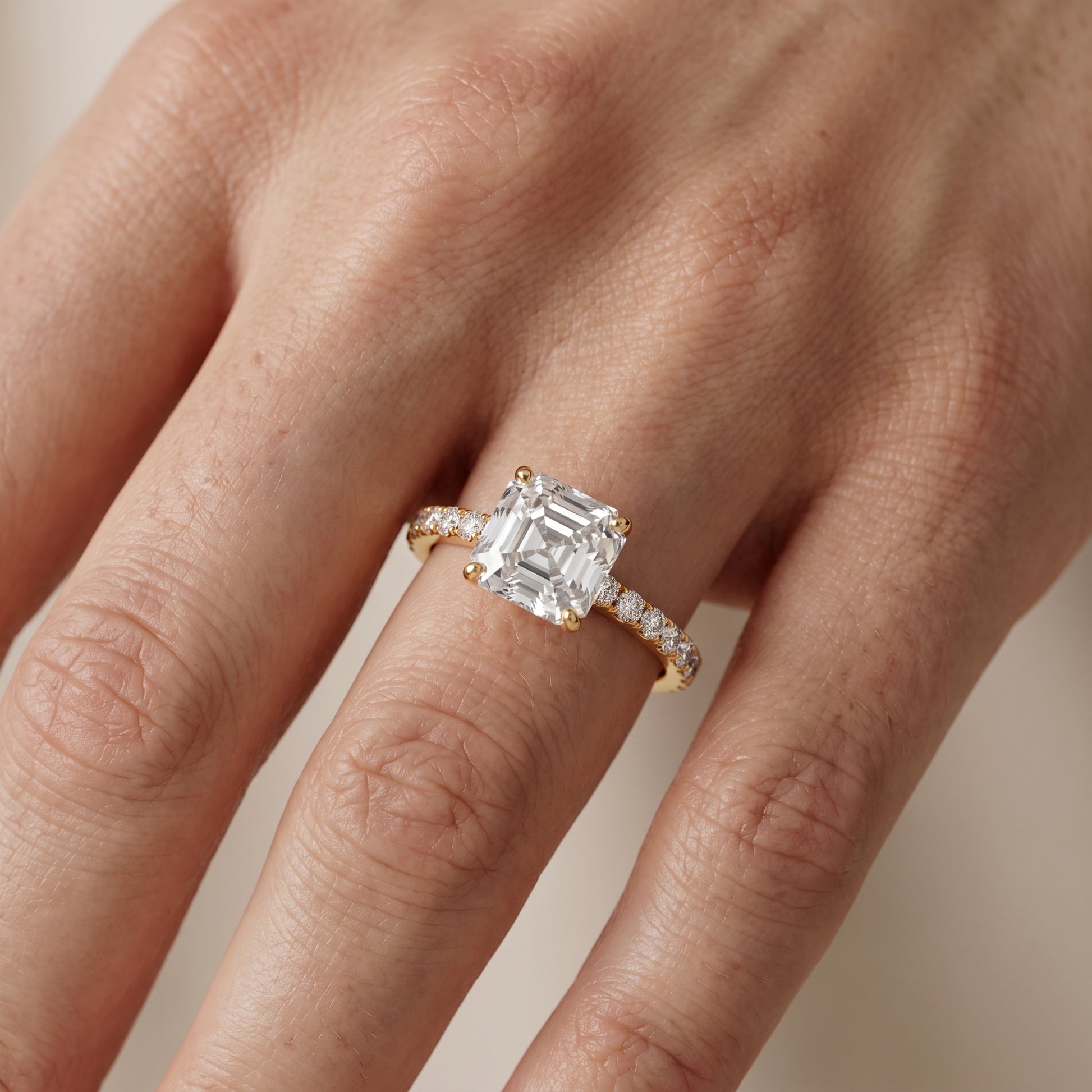 Juna French Pavé Solitaire Asscher Diamond Engagement Ring in Yellow Gold - lifestyle.jpg