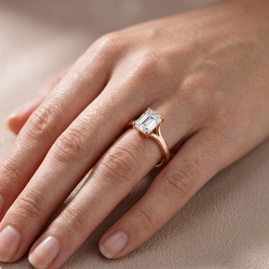 Nell Split Shank Solitaire Emerald Diamond Engagement Ring in Rose Gold - lifestyle.jpg