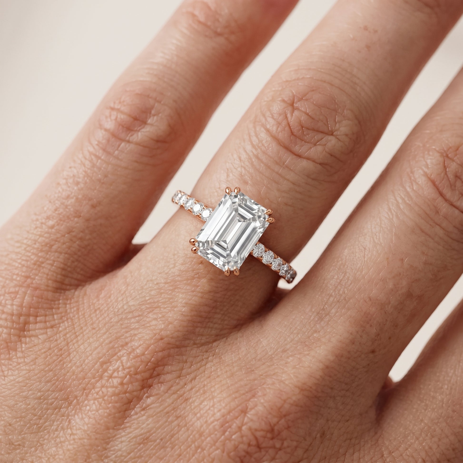 Novara Solitaire Pavé Emerald Diamond Ring in Rose Gold - lifestyle.jpg