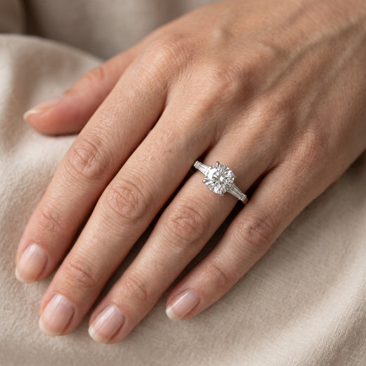 Winnie Three-Stone Cushion Diamond Engagement Ring in Platinum - lifestyle.jpg