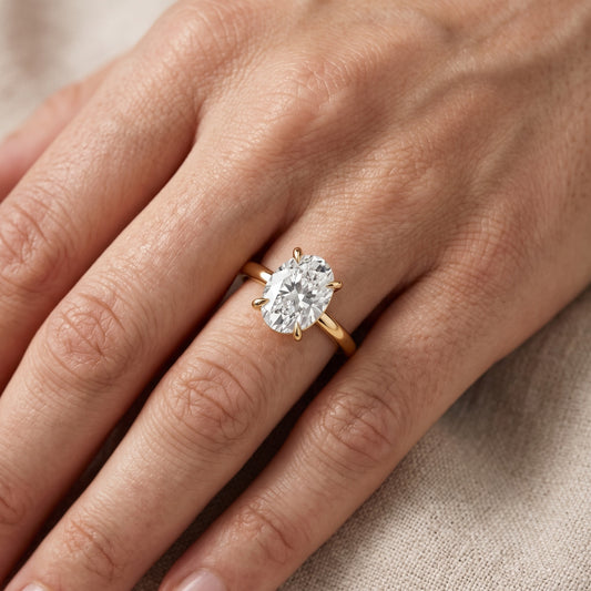 Cassandra Claw Prong Solitaire Oval Diamond Engagement Ring in Yellow Gold - lifestyle.jpg