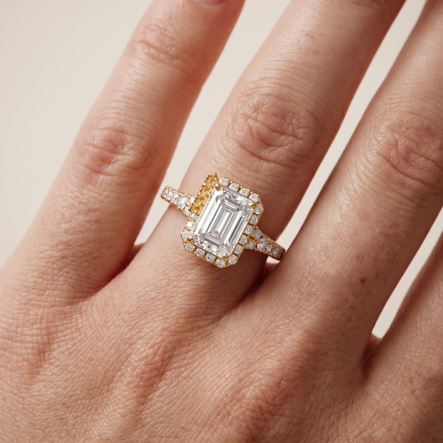 Bella Halo Pavé Emerald Diamond Engagement Ring in Yellow Gold - lifestyle.jpg