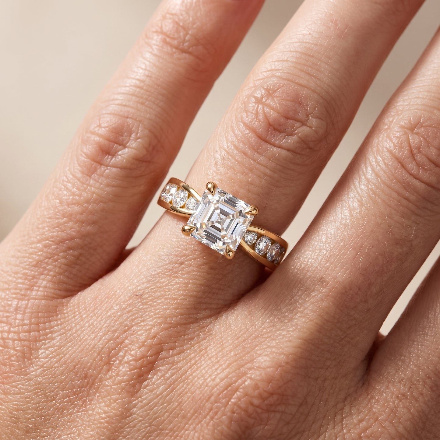 Noor Channel Set Sidestone Asscher Diamond Engagement Ring in Yellow Gold - lifestyle.jpg