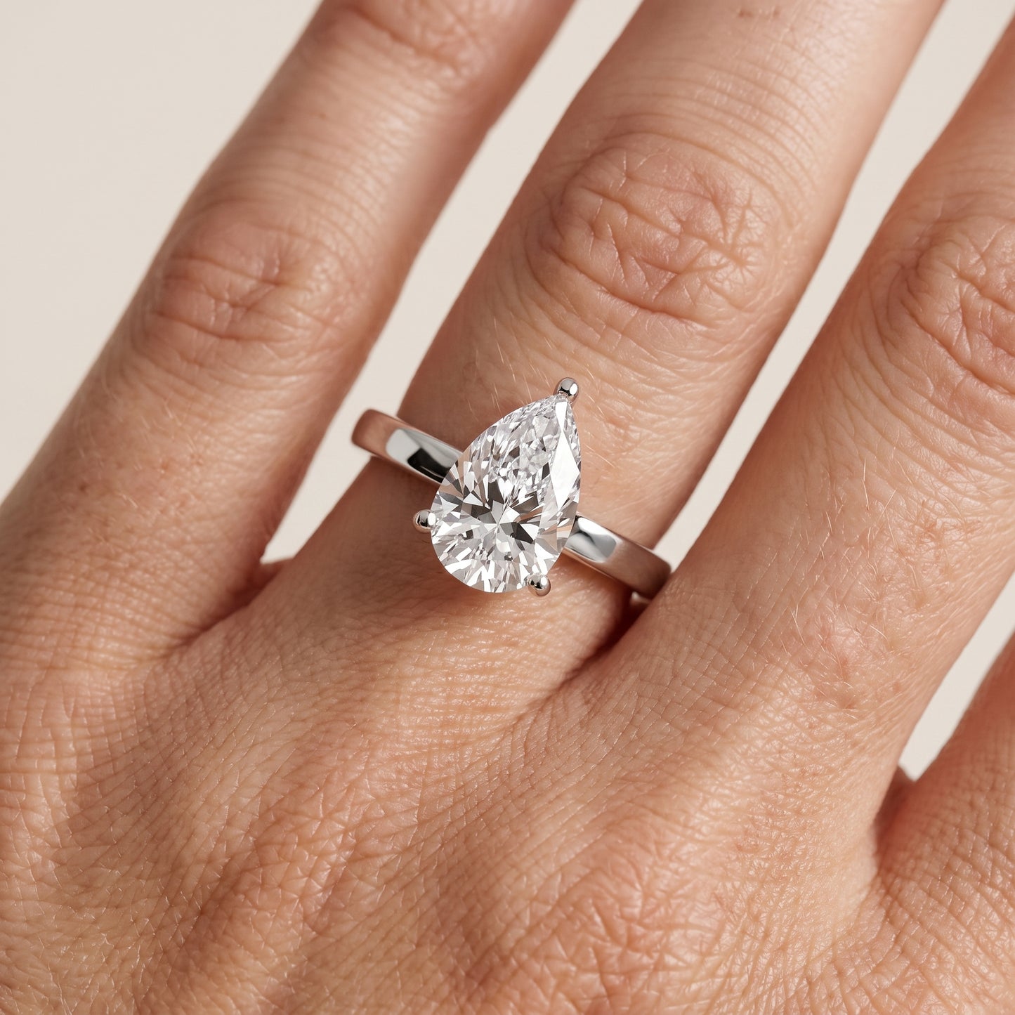 Delia Solitaire Pear Diamond Engagement Ring in Silver - lifestyle.jpg