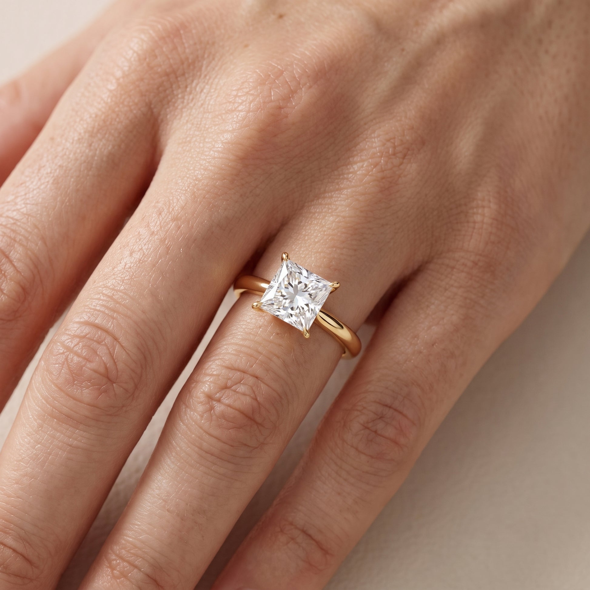 Evie Solitaire Six-Prong Princess Diamond Engagement Ring in Yellow Gold - lifestyle.jpg