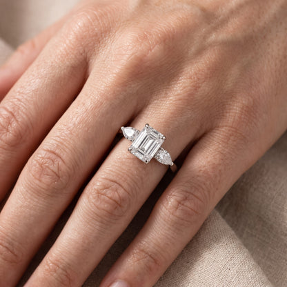 Grace Three Stone Emerald Diamond Engagement Ring in Platinum - lifestyle.jpg