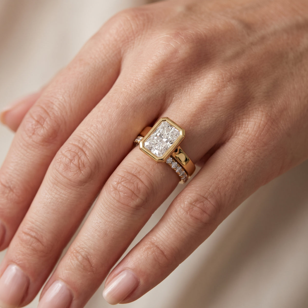 Ayla Bezel Bypass Radiant Diamond Engagement Ring in Yellow Gold - lifestyle.jpg
