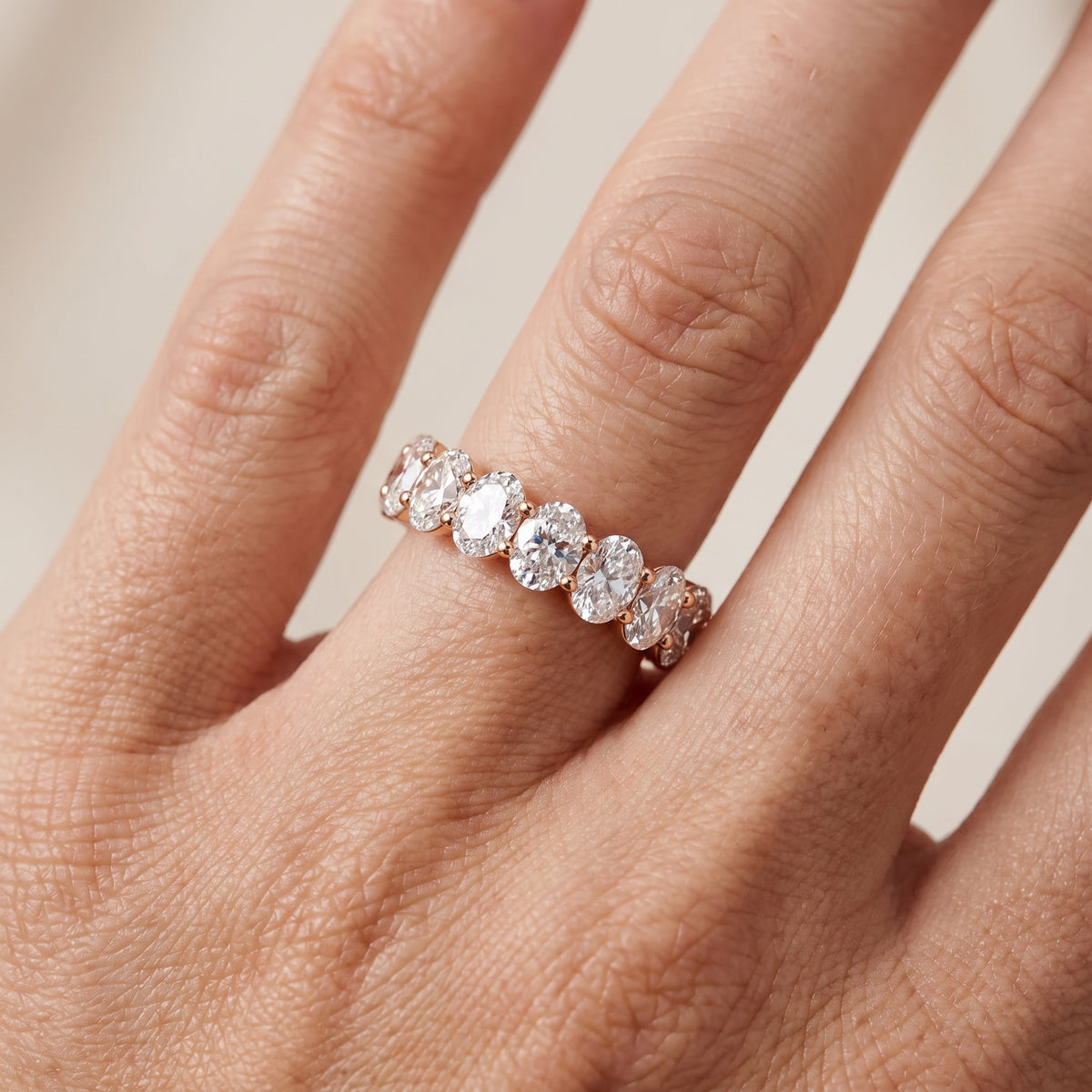 Diana Shared Prong Oval Diamond Eternity Band in Rose Gold - lifestyle.jpg