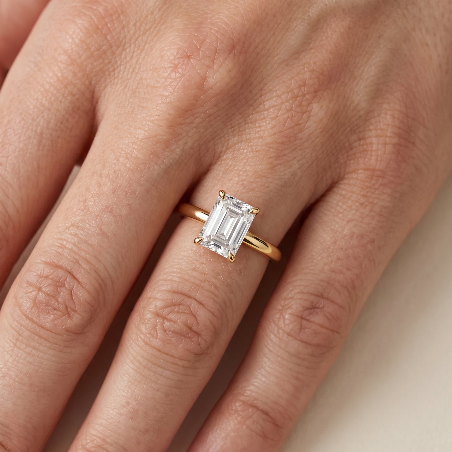 Lyla Petite Solitaire Emerald Diamond Engagement Ring in Yellow Gold - lifestyle.jpg