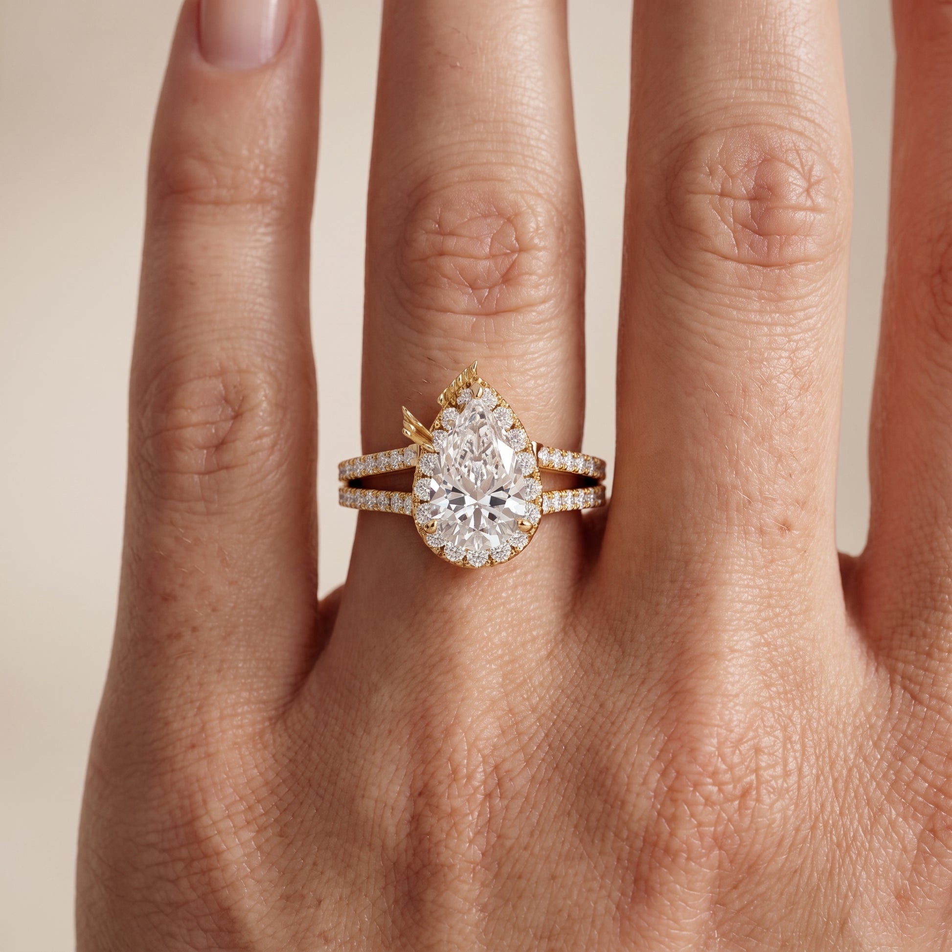Kira Halo Split Shank Pear Diamond Engagement Ring in Yellow Gold - lifestyle.jpg