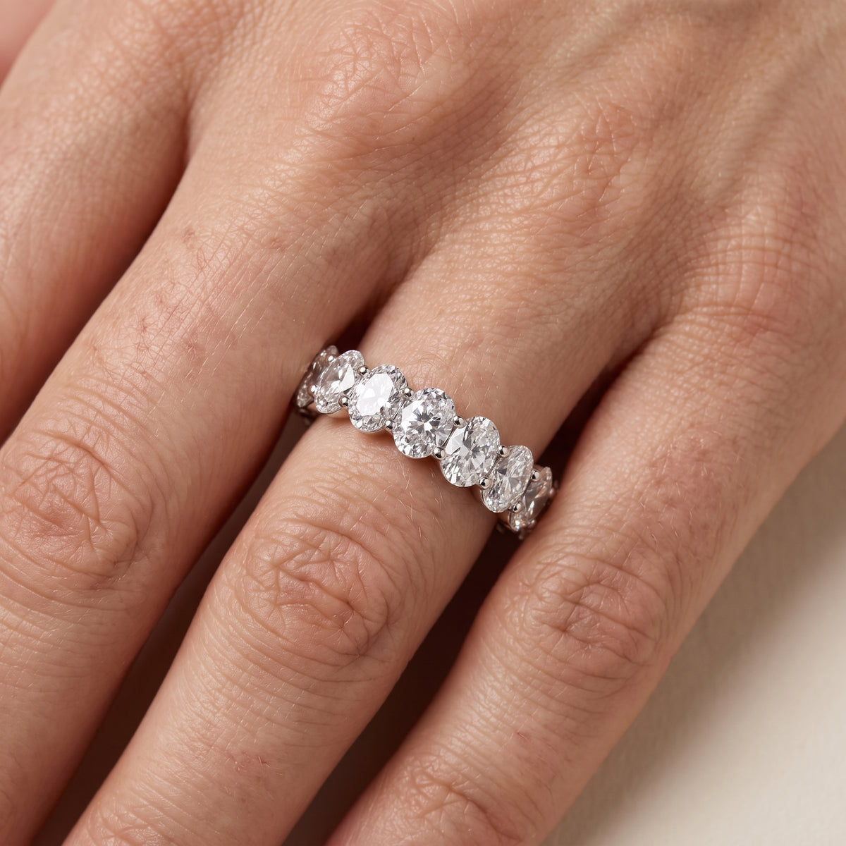 Neha Shared Prong Oval Diamond Eternity Band in White Gold - lifestyle.jpg
