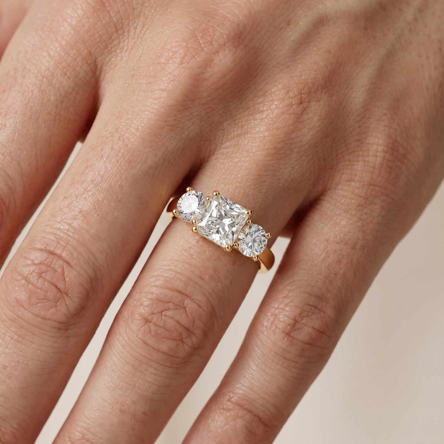 Callie Three-Stone Trellis Radiant Diamond Engagement Ring in Yellow Gold - lifestyle.jpg