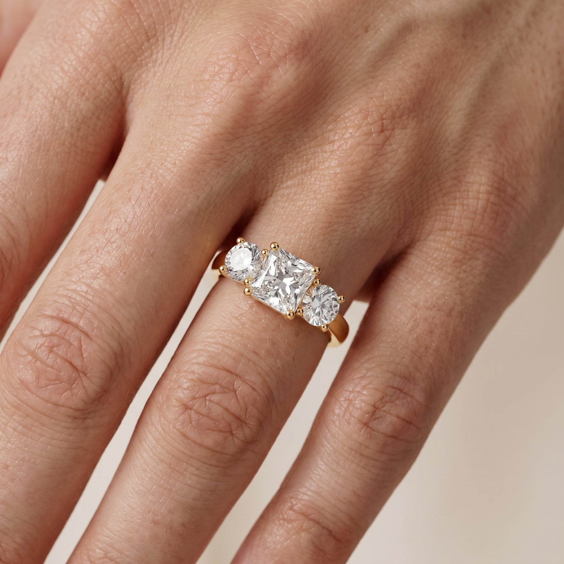 Callie Three-Stone Trellis Radiant Diamond Engagement Ring in Yellow Gold - lifestyle.jpg