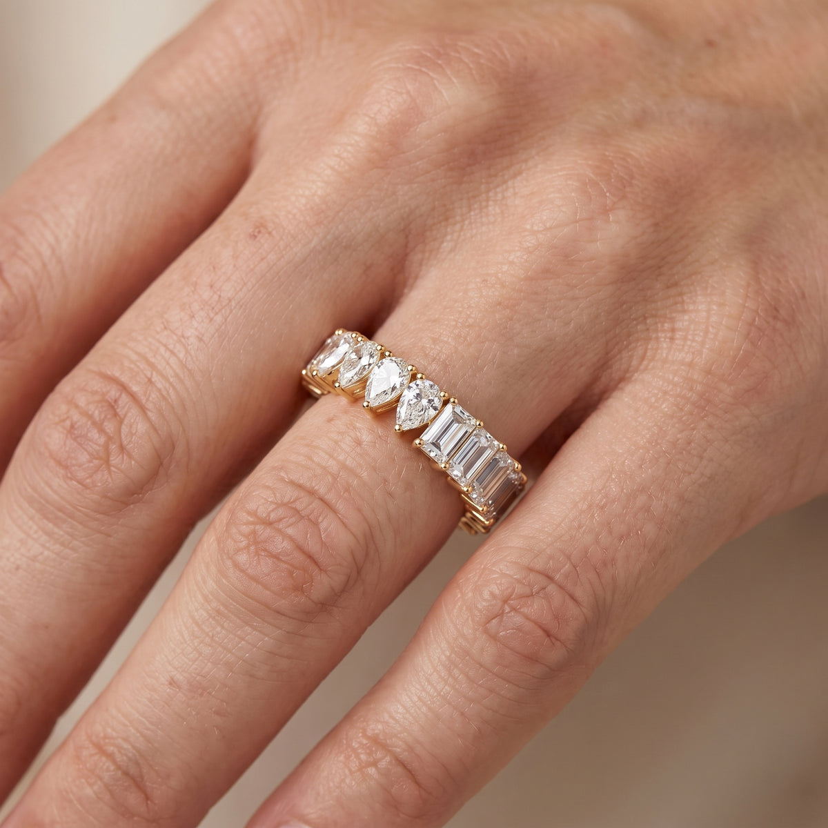 Harriet Shared Prong Pear & Baguette Diamond Eternity Band in Yellow Gold - lifestyle.jpg