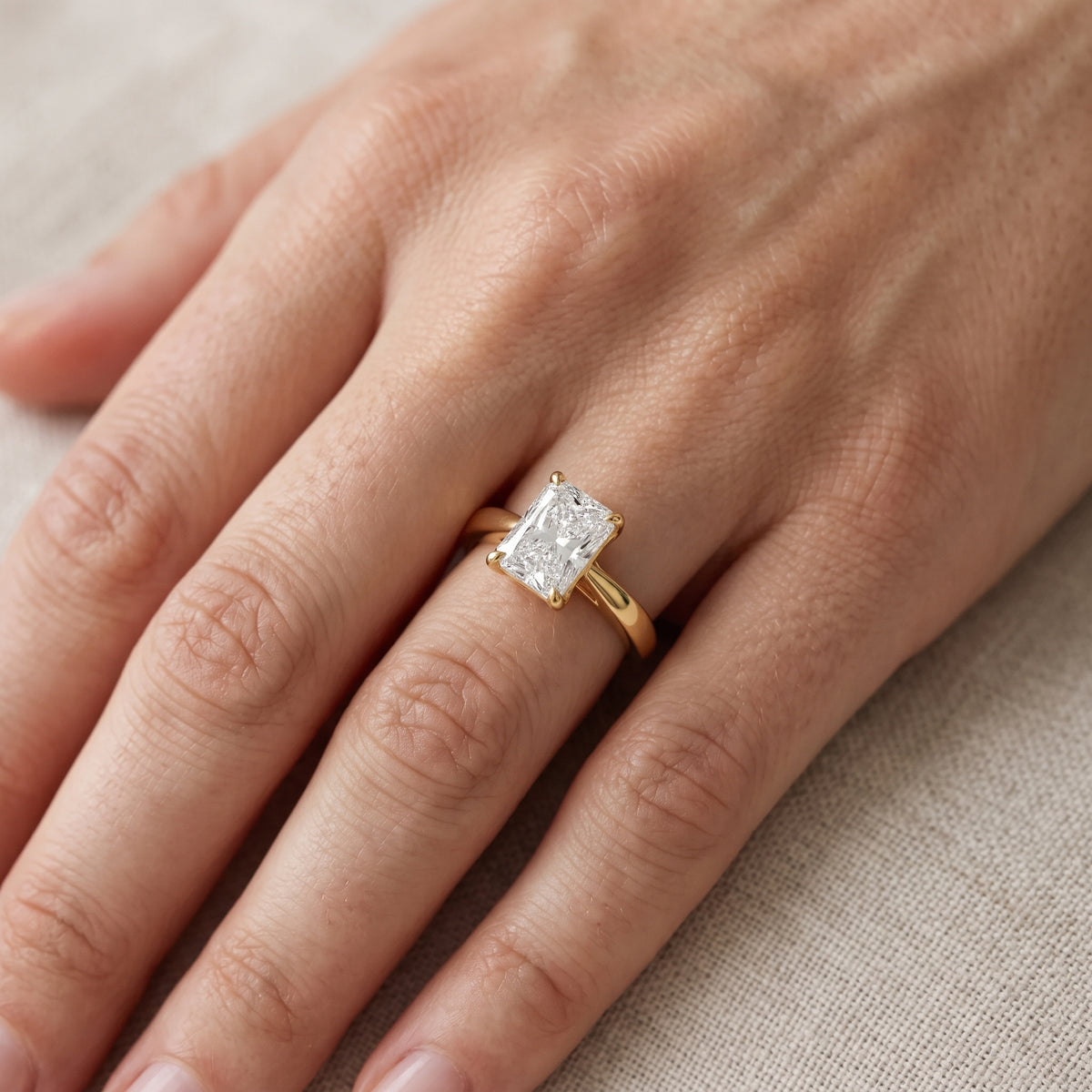 Lucia Solitaire Six-Prong Radiant Diamond Engagement Ring in Yellow Gold - lifestyle.jpg