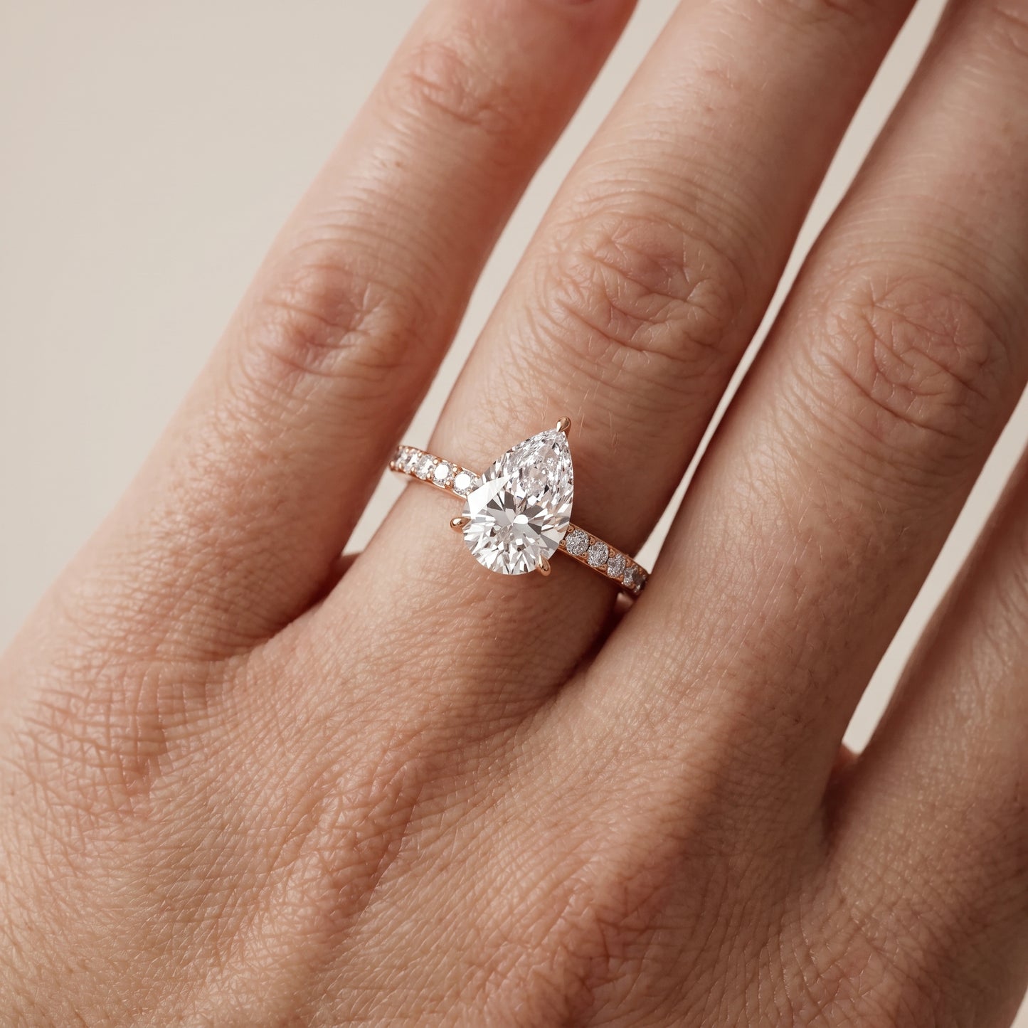 Aisha Pavé Solitaire Pear Diamond Engagement Ring in Rose Gold - lifestyle.jpg