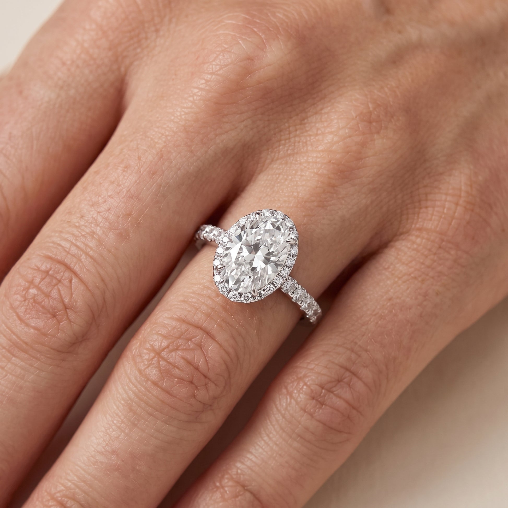 Chloe Halo Pavé Oval Diamond Ring in Platinum - lifestyle.jpg