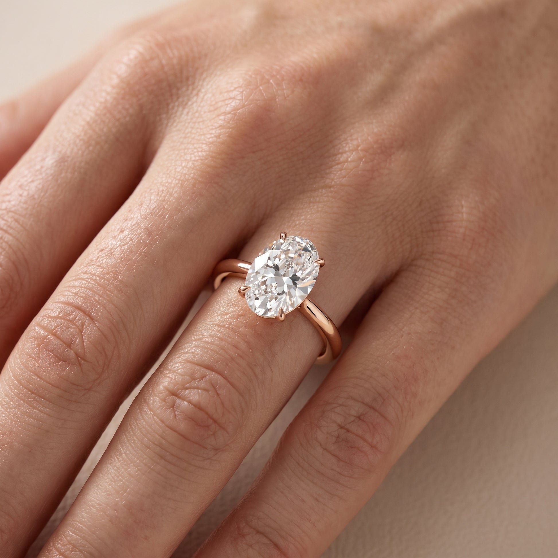 Evie Solitaire Six-Prong Oval Diamond Engagement Ring in Rose Gold - lifestyle.jpg
