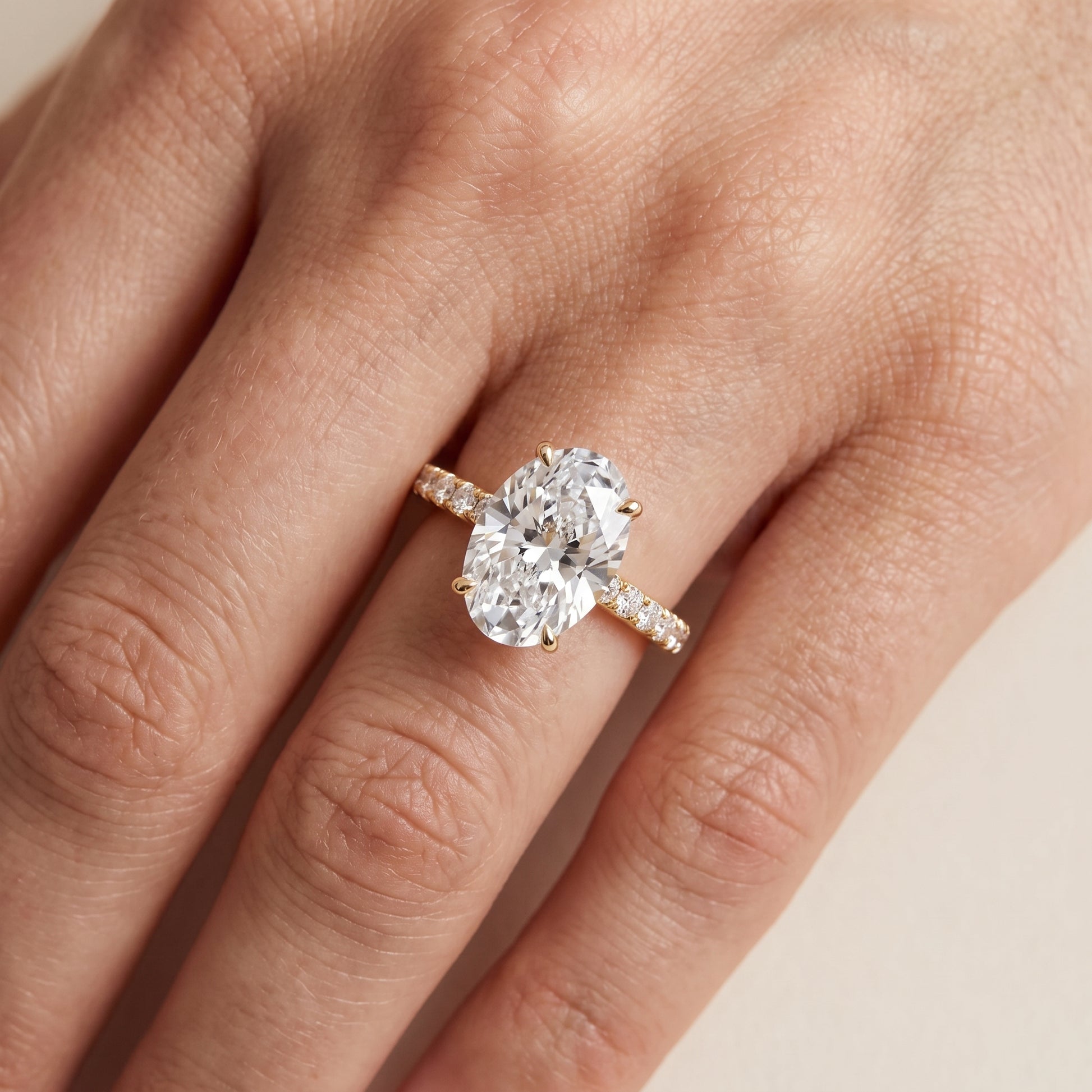 Juna French Pavé Solitaire Oval Diamond Engagement Ring in Yellow Gold - lifestyle.jpg