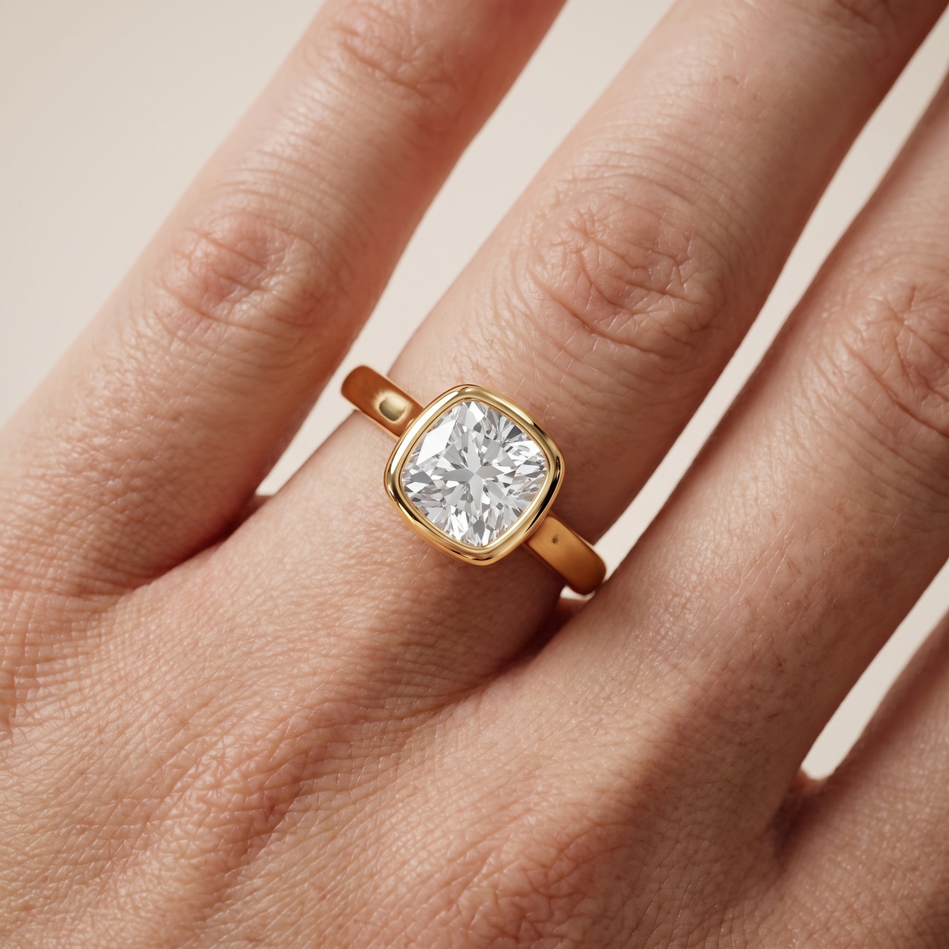 Jolie Bezel Solitaire Cushion Diamond Engagement Ring in Yellow Gold - lifestyle.jpg