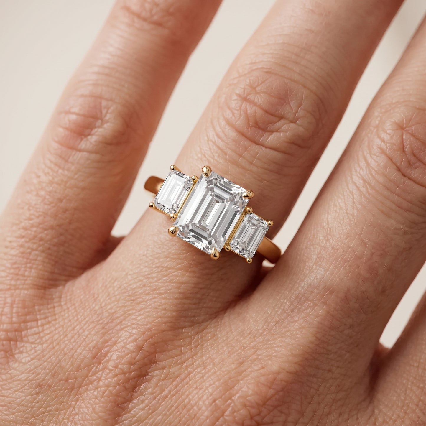 Zoe Three-Stone Emerald Diamond Ring in Yellow Gold - lifestyle.jpg
