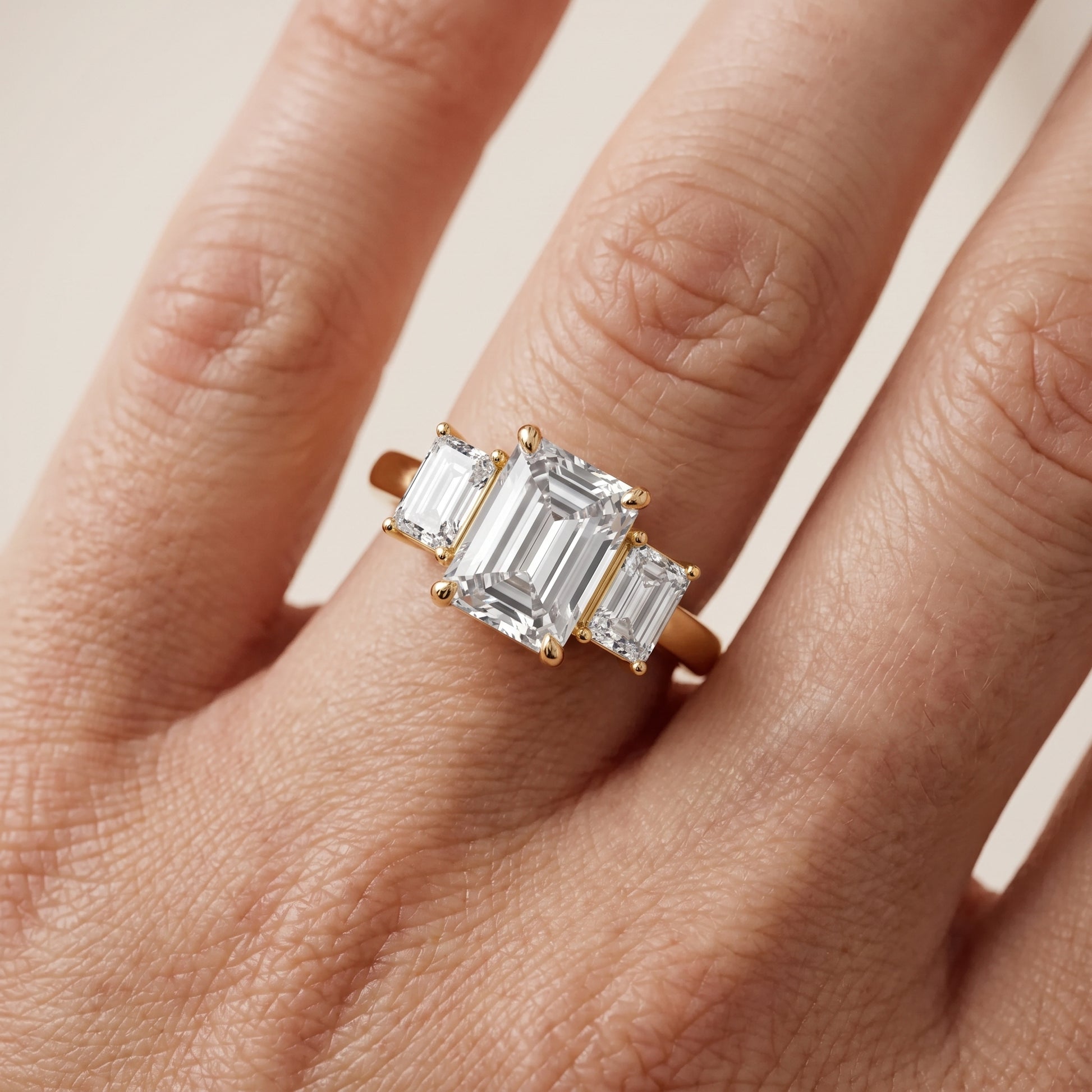 Zoe Three-Stone Emerald Diamond Ring in Yellow Gold - lifestyle.jpg