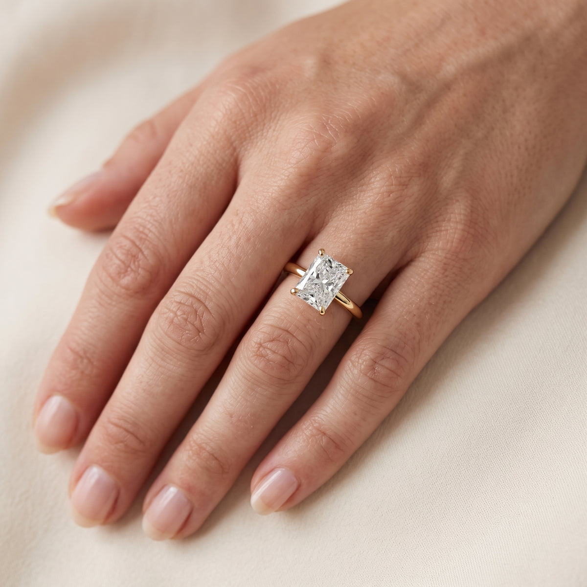 Elena Solitaire Radiant Diamond Engagement Ring in Yellow Gold - lifestyle.jpg