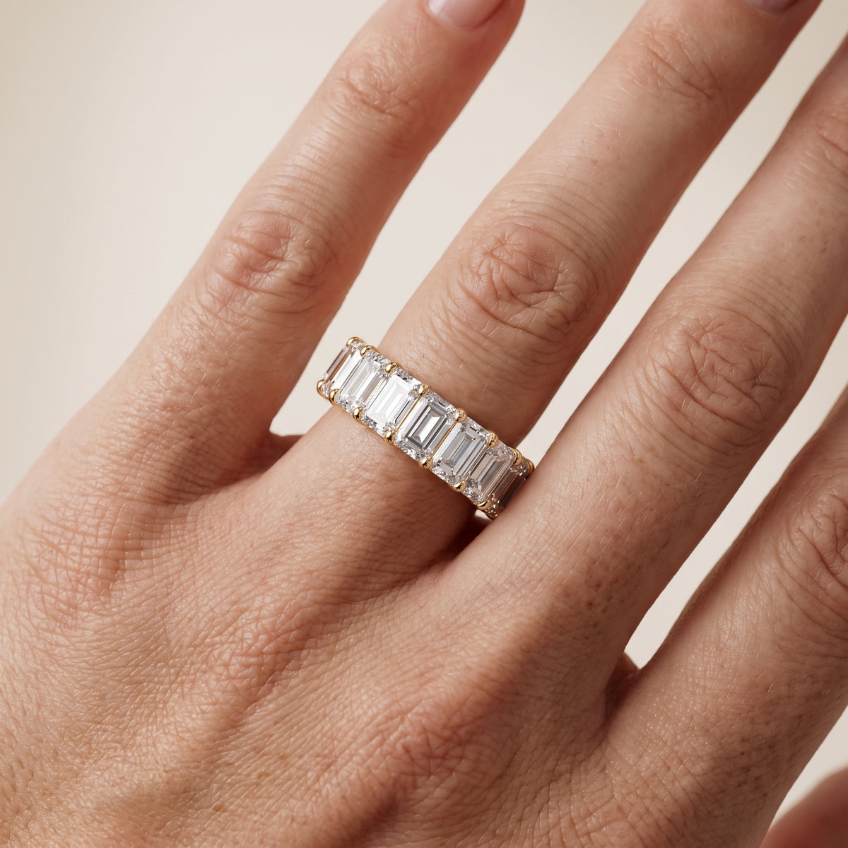 Violet Shared Prong Emerald Diamond Eternity Band in Yellow Gold - lifestyle.jpg