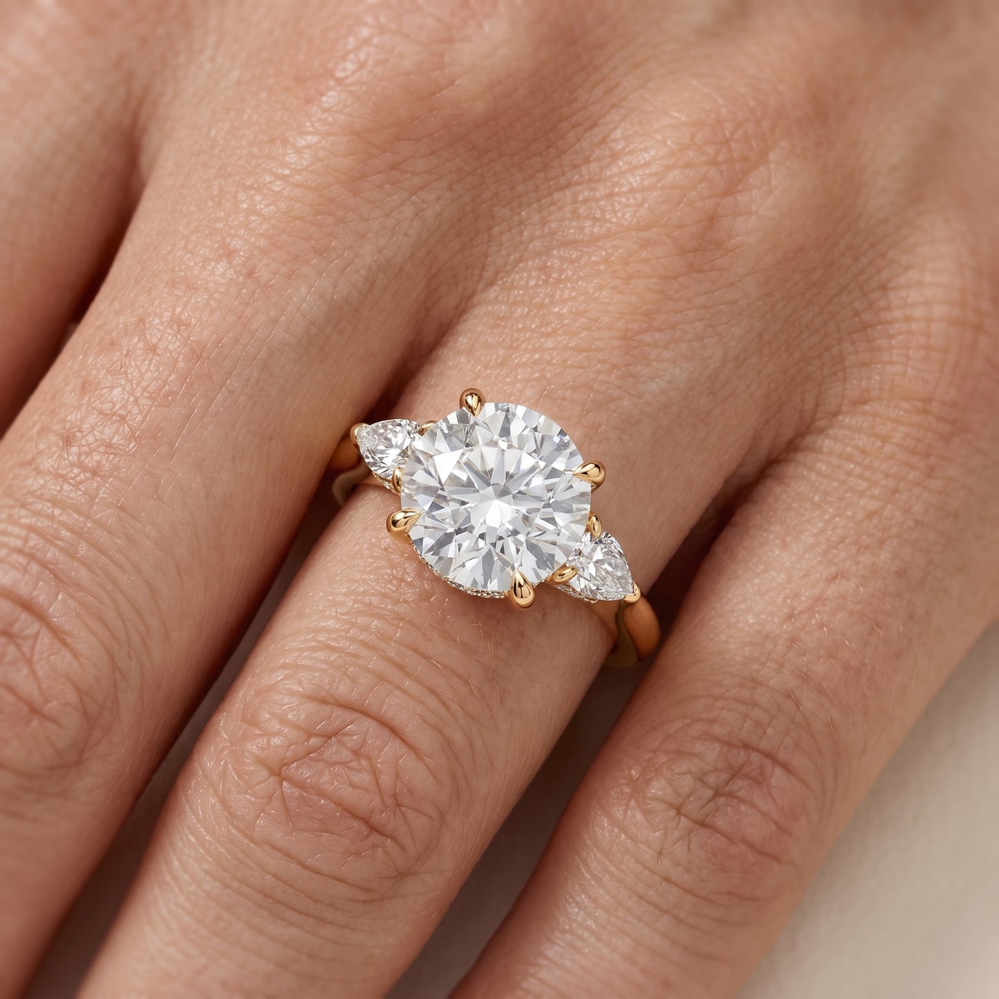 Leila Three-Stone Round Diamond Engagement Ring in Yellow Gold - lifestyle.jpg