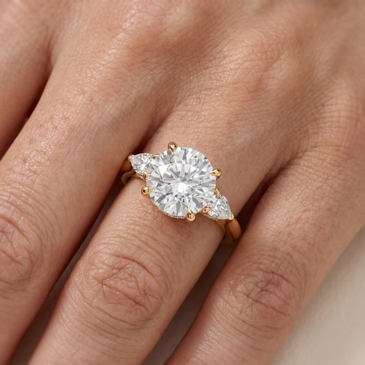 Leila Three-Stone Round Diamond Engagement Ring in Yellow Gold - lifestyle.jpg