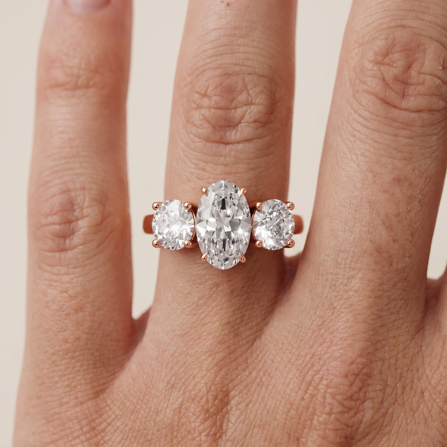 Esme Three-Stone Tapered Oval Diamond Ring in Rose Gold - lifestyle.jpg