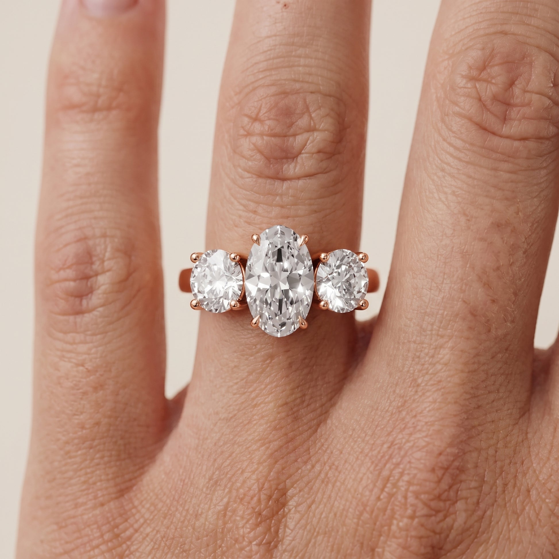 Esme Three-Stone Tapered Oval Diamond Ring in Rose Gold - lifestyle.jpg