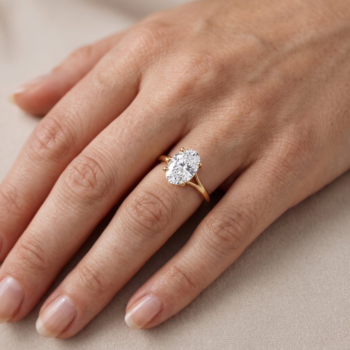 Melanie Solitaire Split Shank Oval Diamond Engagement Ring in Platinum - lifestyle.jpg