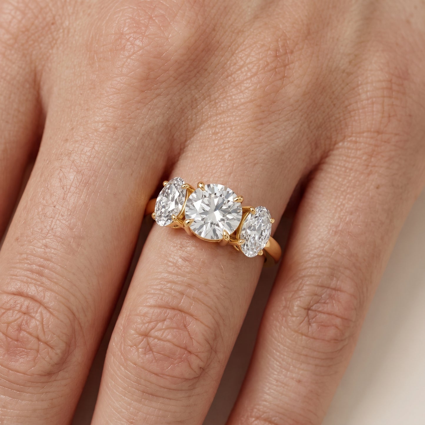 Lila Three-Stone Round Diamond Ring in Yellow Gold - lifestyle.jpg
